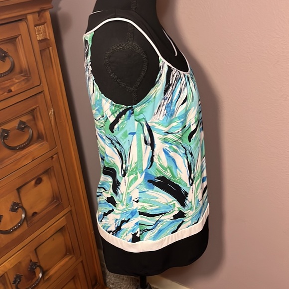 This is a blue abstractly patterned tank top with black trim - Picture 4 of 5